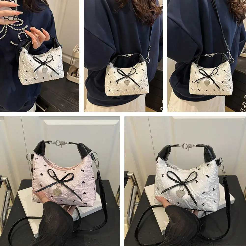 Bow Crossbody bag for women Sweet Fashion Print Metal heart Pendant Hand-held Single shoulder bag Commute Handbag Underarm pouchT2511112