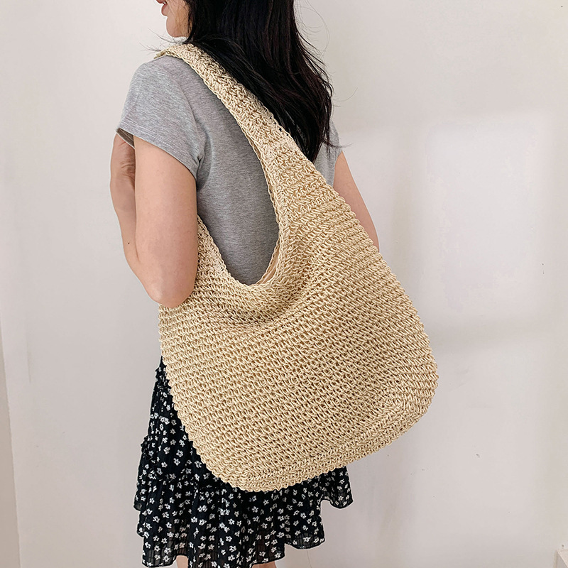 2025S Designer Women S Bag Spring And Summer Vacation Style Tote Grass Woven Shopping Women S Hand Held Beach Versatile Solid Color Shoulder Bag