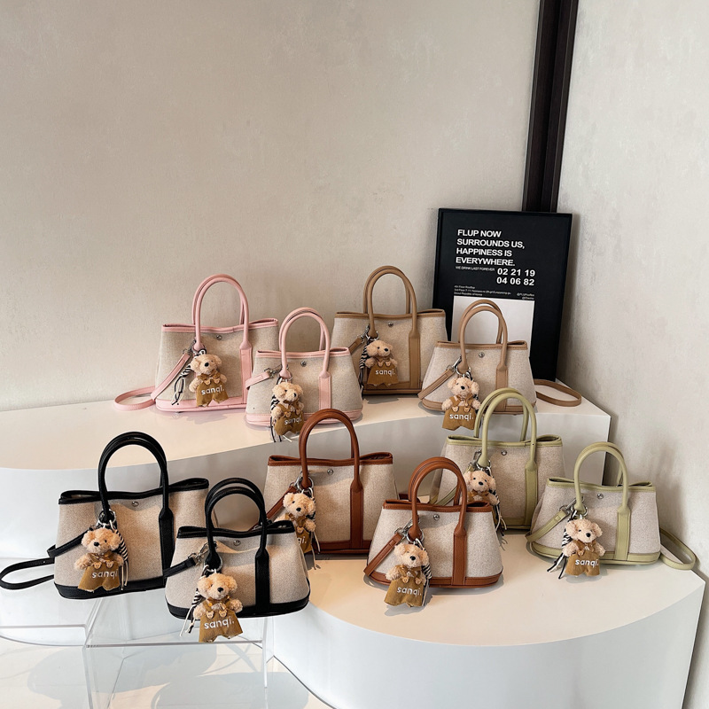 2025S Designer Women S Bag New Fashionable Handheld Bucket For Women In Spring Forest Cute Versatile Canvas Mother And Child Bag Popular Crossbody Bag