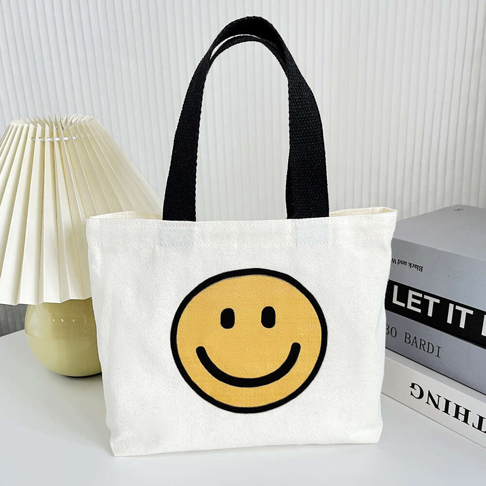 New 2024 canvas summer cute smiling face handbag, internet famous fashion mini bag, women's bag