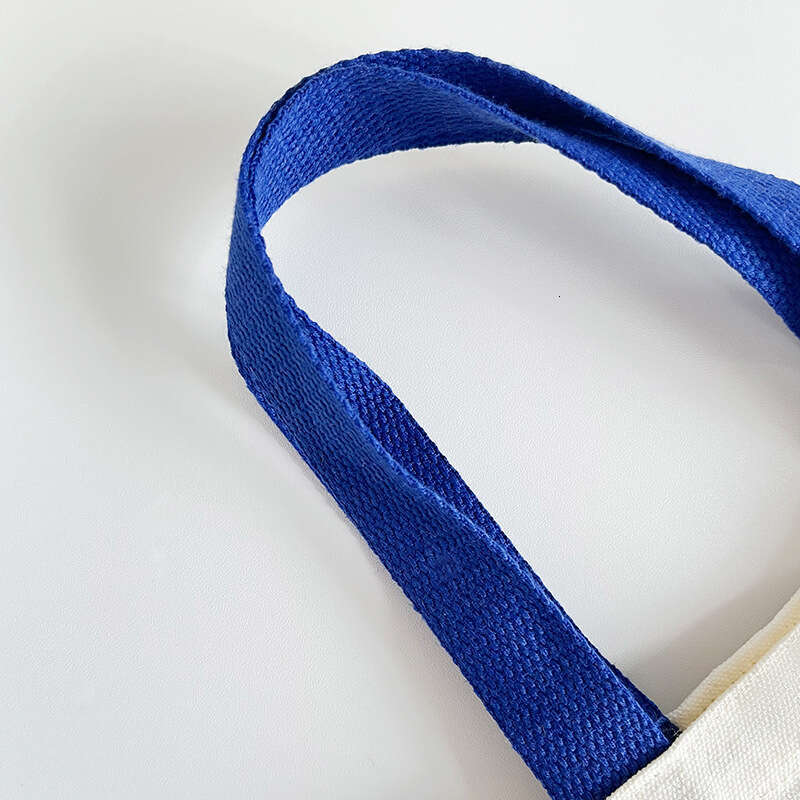 New 2024 canvas summer cute smiling face handbag, internet famous fashion mini bag, women's bag