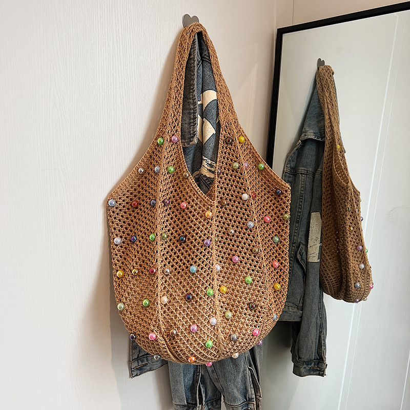 2025S Designer Women S Bag Knitted Handbag Handheld Women S Japanese Handwoven Hollow Casual One Shoulder Tank Top Large Capacity Crossbody Bag