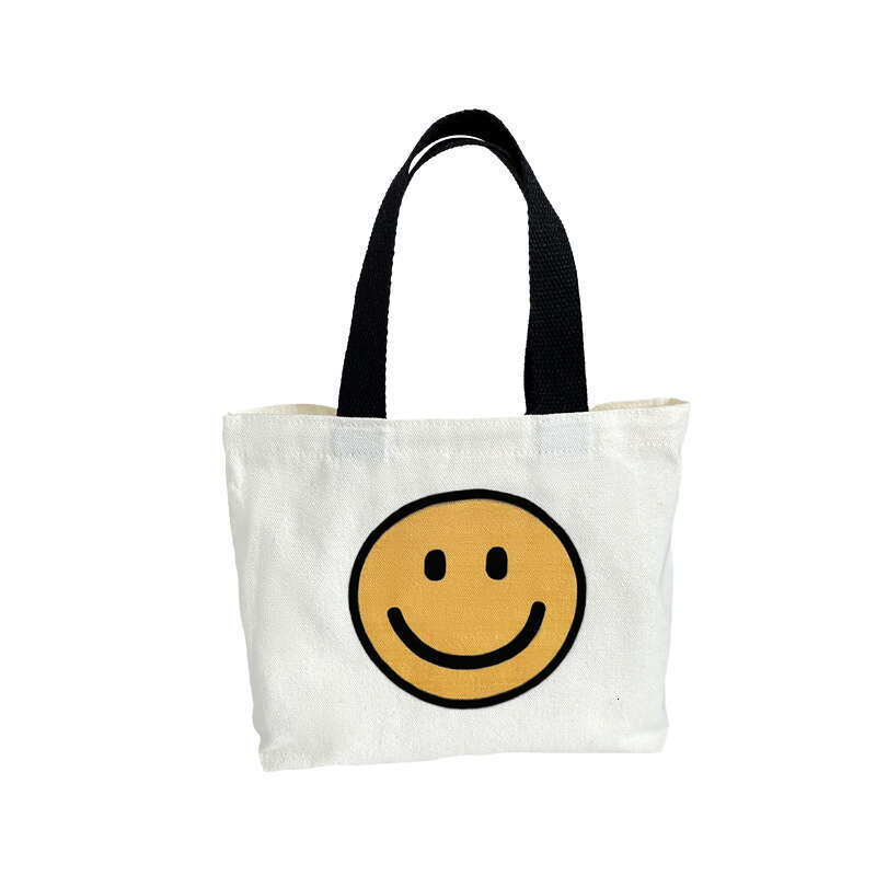 New 2024 canvas summer cute smiling face handbag, internet famous fashion mini bag, women's bag