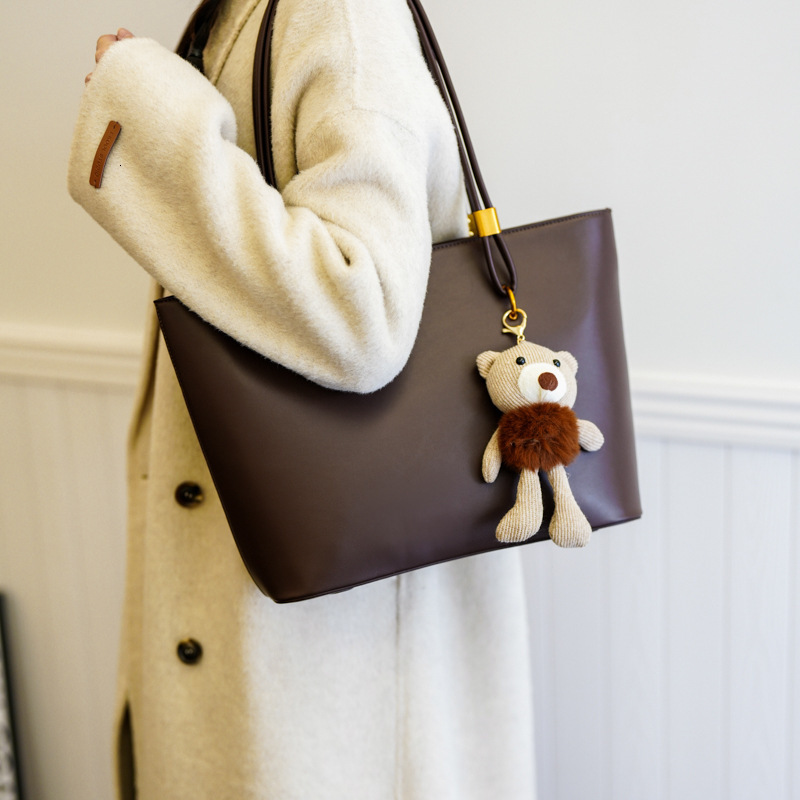 2025S Designer Women S Bag Large Capacity Minimalist Tote For Women S Outdoor Commuting Versatile Shoulder Bag PU Texture Solid Color Casual Handbag