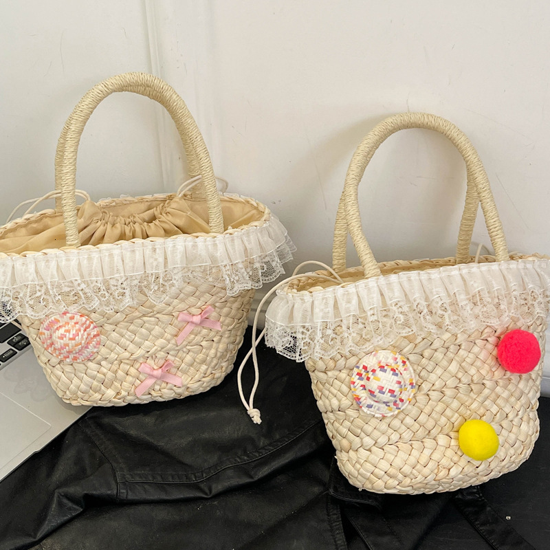 2025S Designer Women S Bag Summer New Straw Woven For Women With High Beauty Kitty Lightweight Handheld Women S Bag Cute Pendant Bow Weaving