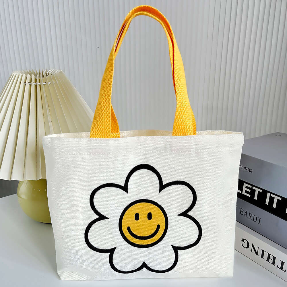 New 2024 canvas summer cute smiling face handbag, internet famous fashion mini bag, women's bag