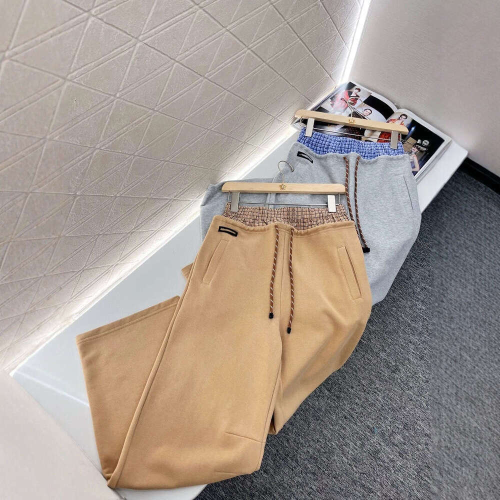 Designer clothing Designer clothing Nanyou Miu series casual for spring 2025, new color blocking plaid double waistband drawstring letter logo straigh