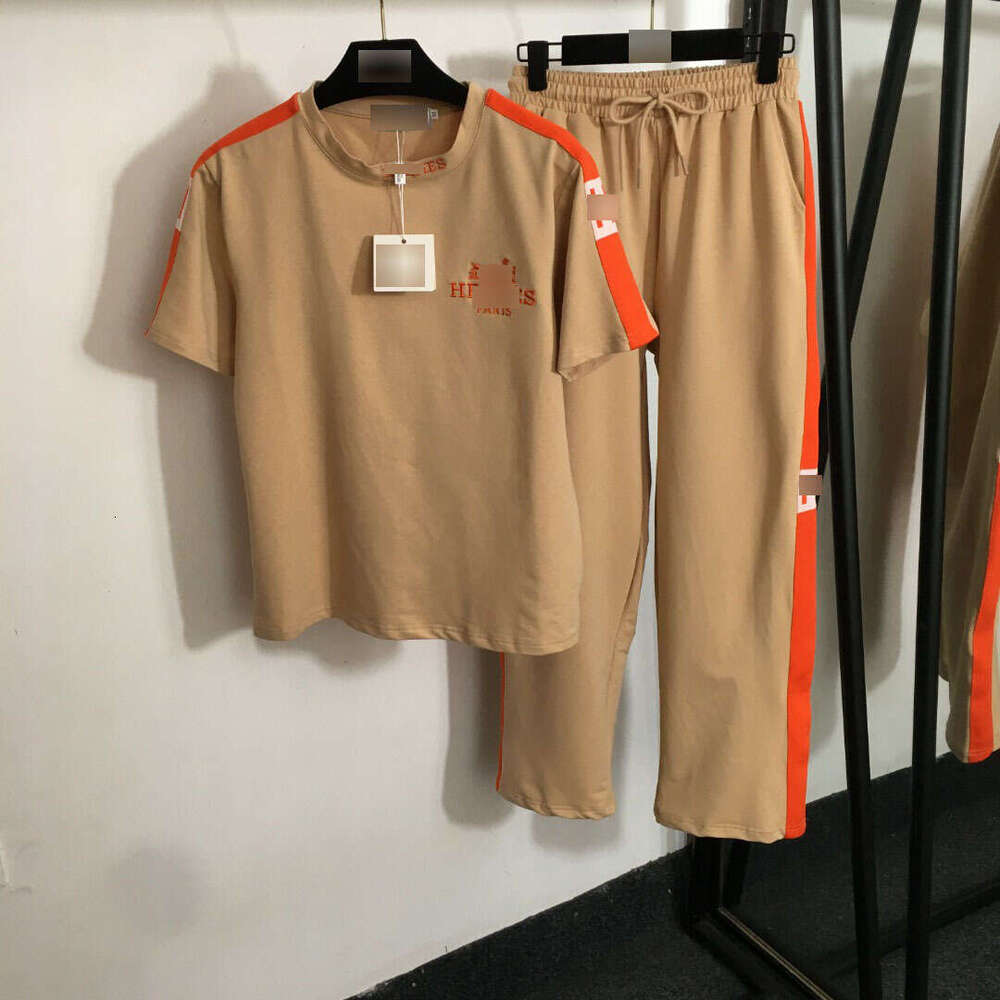 25 new summer Nanyou sports suit with embroidered carriage on the chest, short sleeved T-shirt and woven edge casual pants