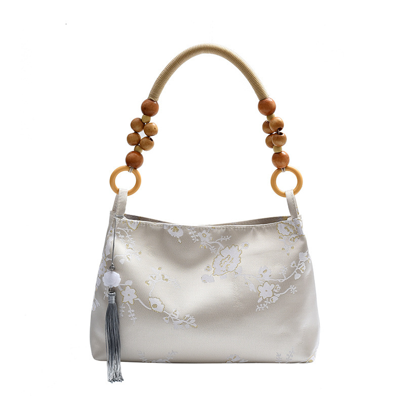 2025S Designer Women S Bag New For Women New Niche Velvet Embossed Artistic Chinese Style Armpit Bag Simple Wooden Bead Casual Handbag