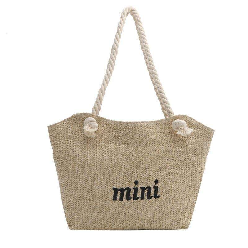 Handheld straw women's new summer woven shoulder bag, simple water bucket, casual large capacity tote bag
