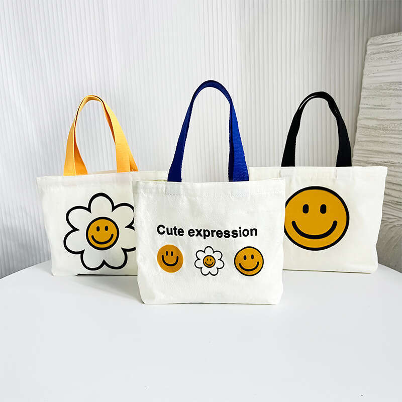 New 2024 canvas summer cute smiling face handbag, internet famous fashion mini bag, women's bag