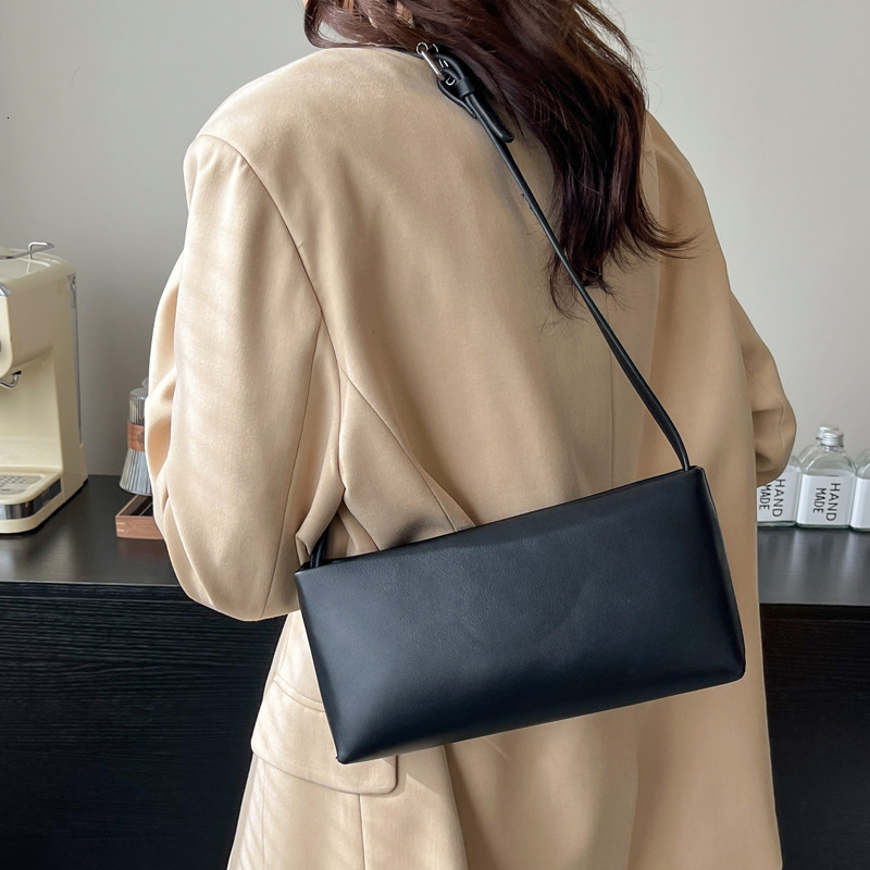 2025S Designer Women S Bag Advanced Style Armpit French Minimalist Niche Design Hand Held Solid Color Small Square Bag Trendy Single Shoulder Crossbod