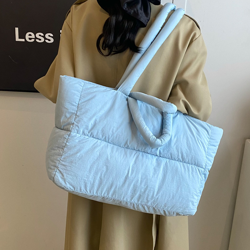2025S Designer Women S Bag Women S New Cotton Down Jackets Niche South Korean Space Bags One Shoulder Tote Oversized Bags Popular This Year