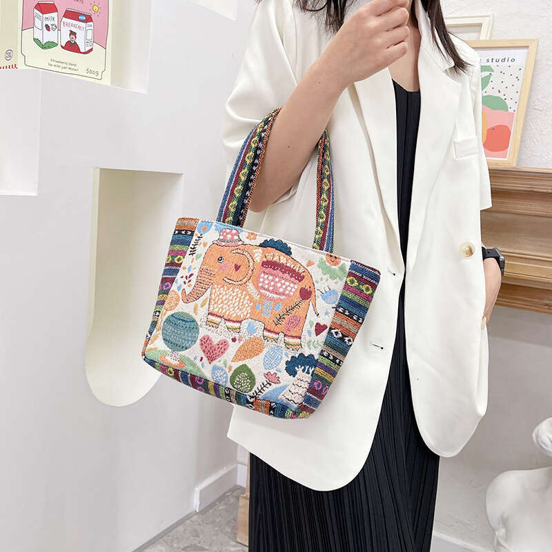 Cartoon embroidery canvas women's ethnic style casual mommy handbag, office worker small shoulder bag