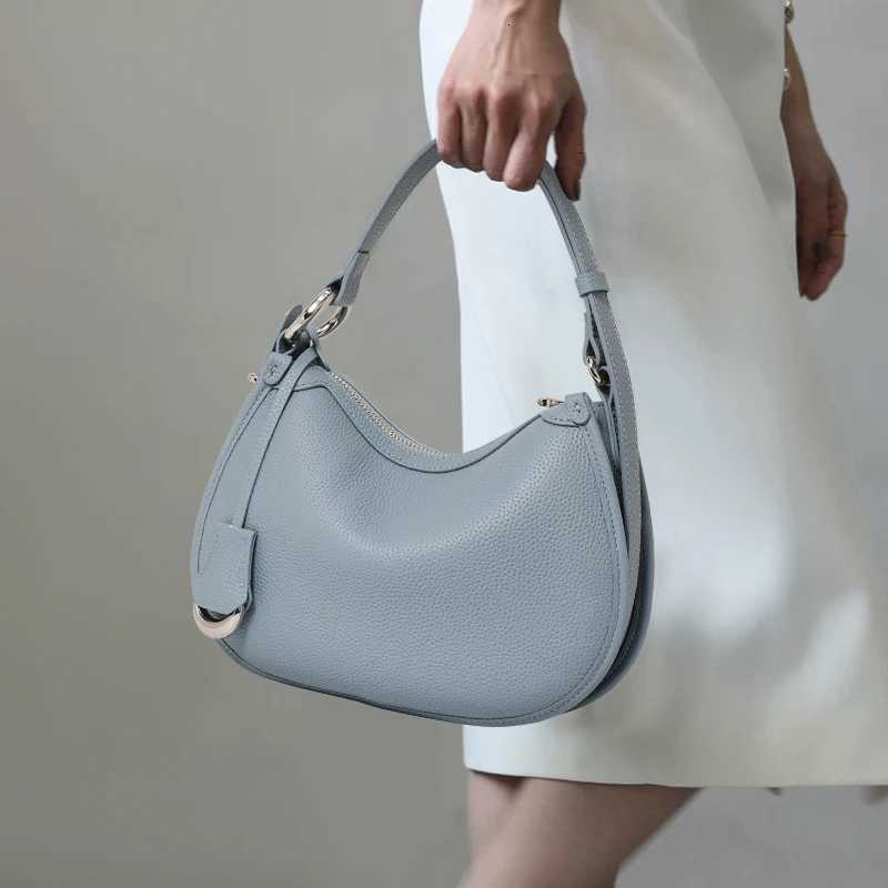 The first layer of cowhide underarm shoulder bag 2025 new niche design minimalist blue fashion soft leather hand saddle bagW251112