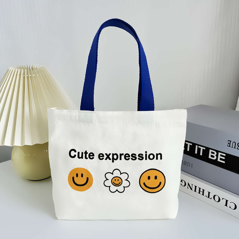 New 2024 canvas summer cute smiling face handbag, internet famous fashion mini bag, women's bag