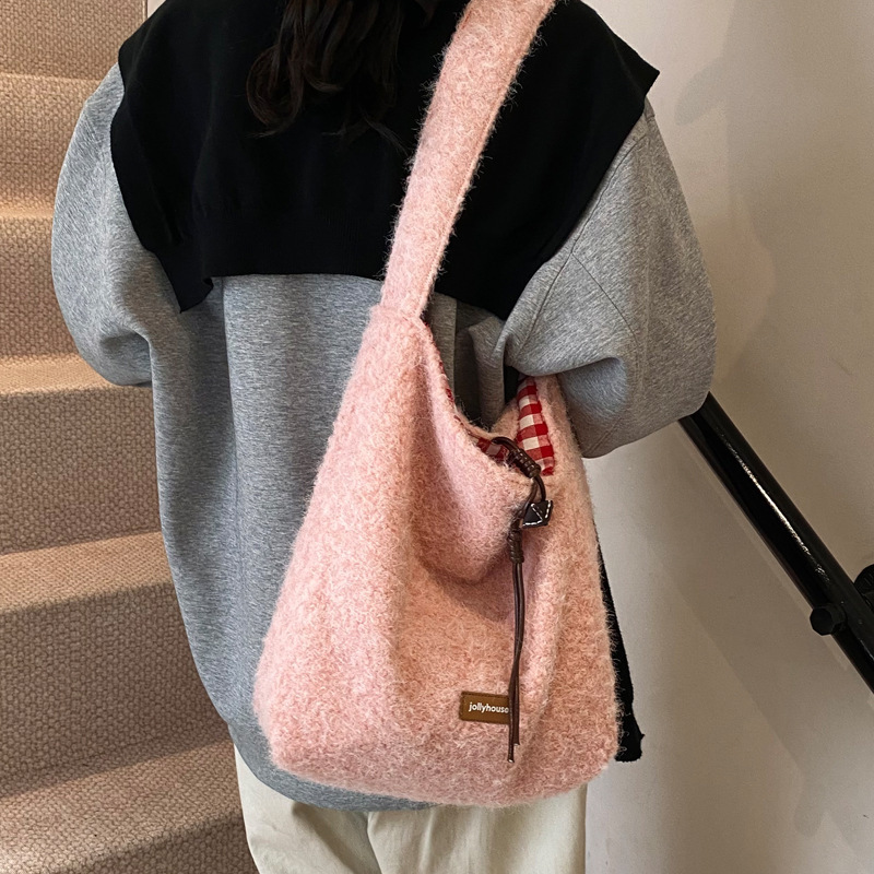 2025S Designer Women S Bag Winter Plush Bucket With Large Capacity Casual And Lazy Style Tote Fashionable Women S Bag Work Commuting Shoulder Bag