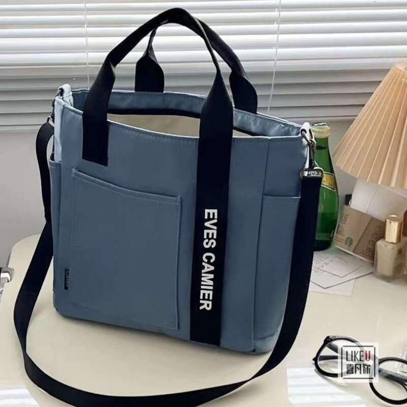 designer bag New design waterproof stylish tote canvas crossbody bag, simple and versatile, single shoulder hand-held bento lunch box bag