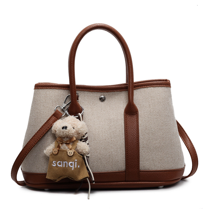 2025S Designer Women S Bag New Fashionable Handheld Bucket For Women In Spring Forest Cute Versatile Canvas Mother And Child Bag Popular Crossbody Bag