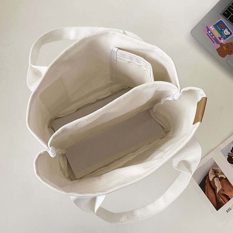 New Japanese high-capacity thousand layer canvas for spring and summer, women's small handbag, fashionable mommy bag trend