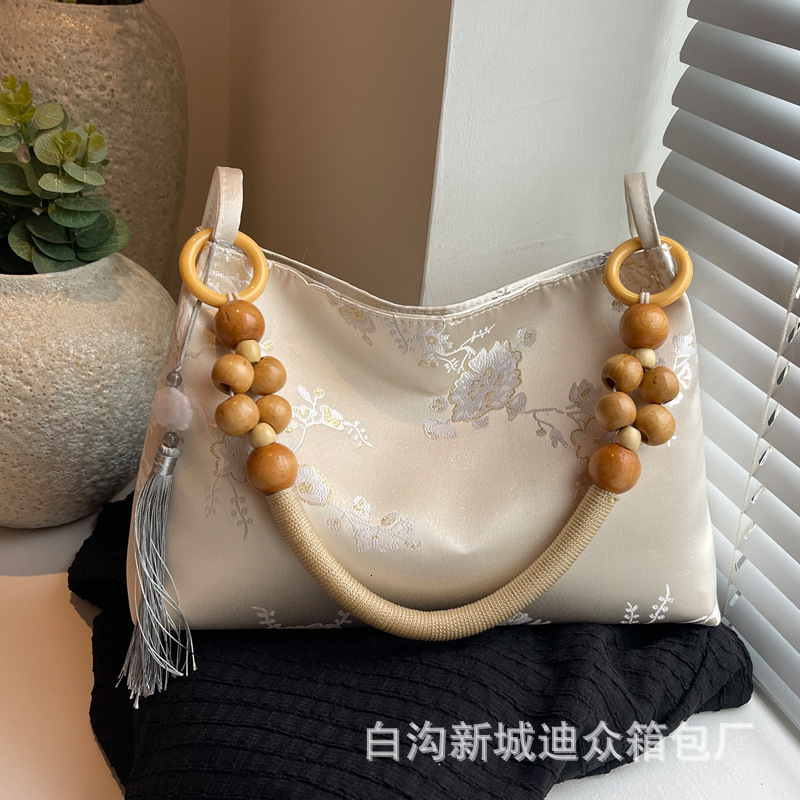 2025S Designer Women S Bag New For Women New Niche Velvet Embossed Artistic Chinese Style Armpit Bag Simple Wooden Bead Casual Handbag