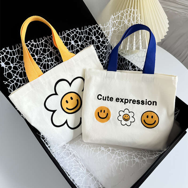 New 2024 canvas summer cute smiling face handbag, internet famous fashion mini bag, women's bag