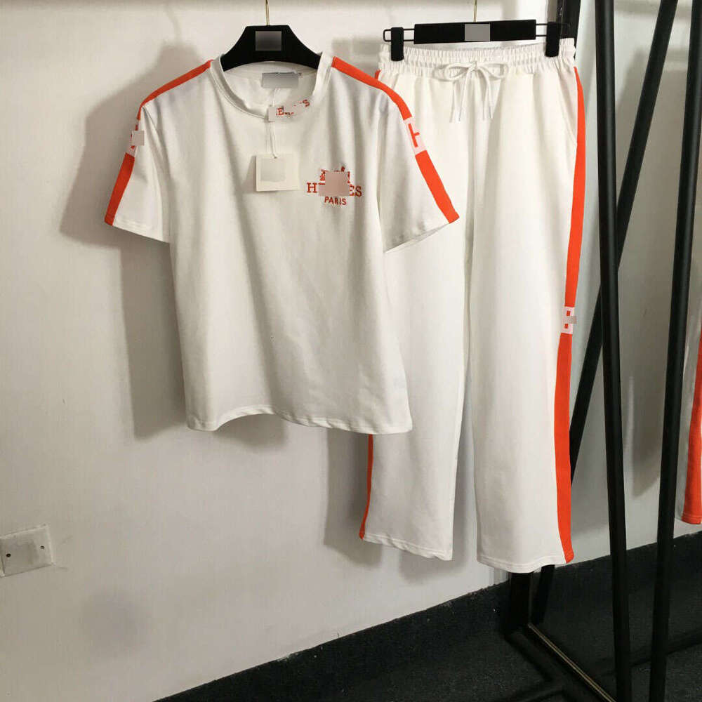 25 new summer Nanyou sports suit with embroidered carriage on the chest, short sleeved T-shirt and woven edge casual pants