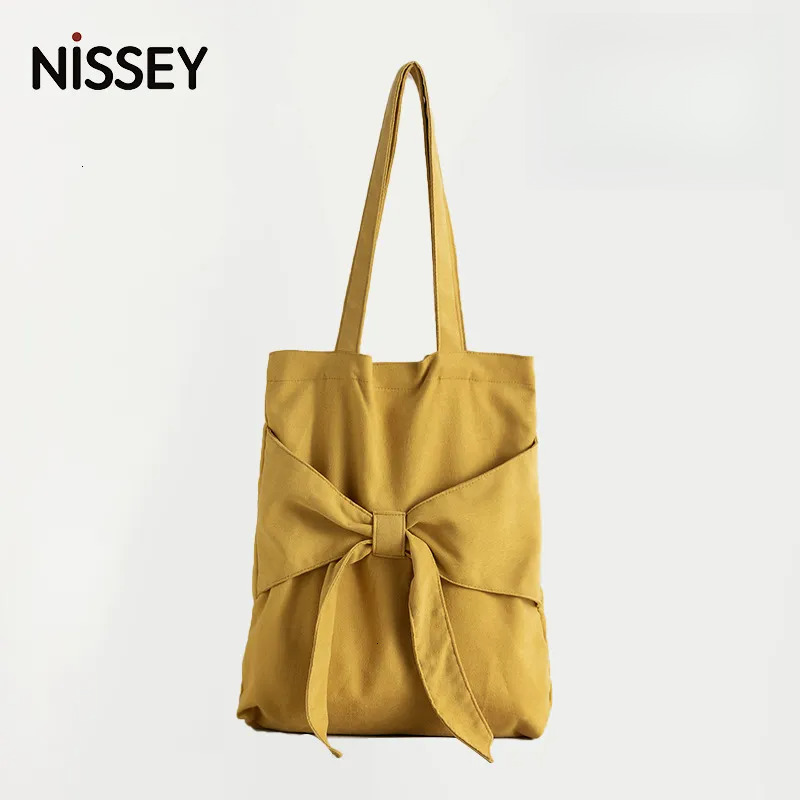 2025S New Model Designer Bag Bowtie Tote Artistic Single Shoulder Women S Student Canvas Bag Niche Design Large Capacity Handbag Totebag