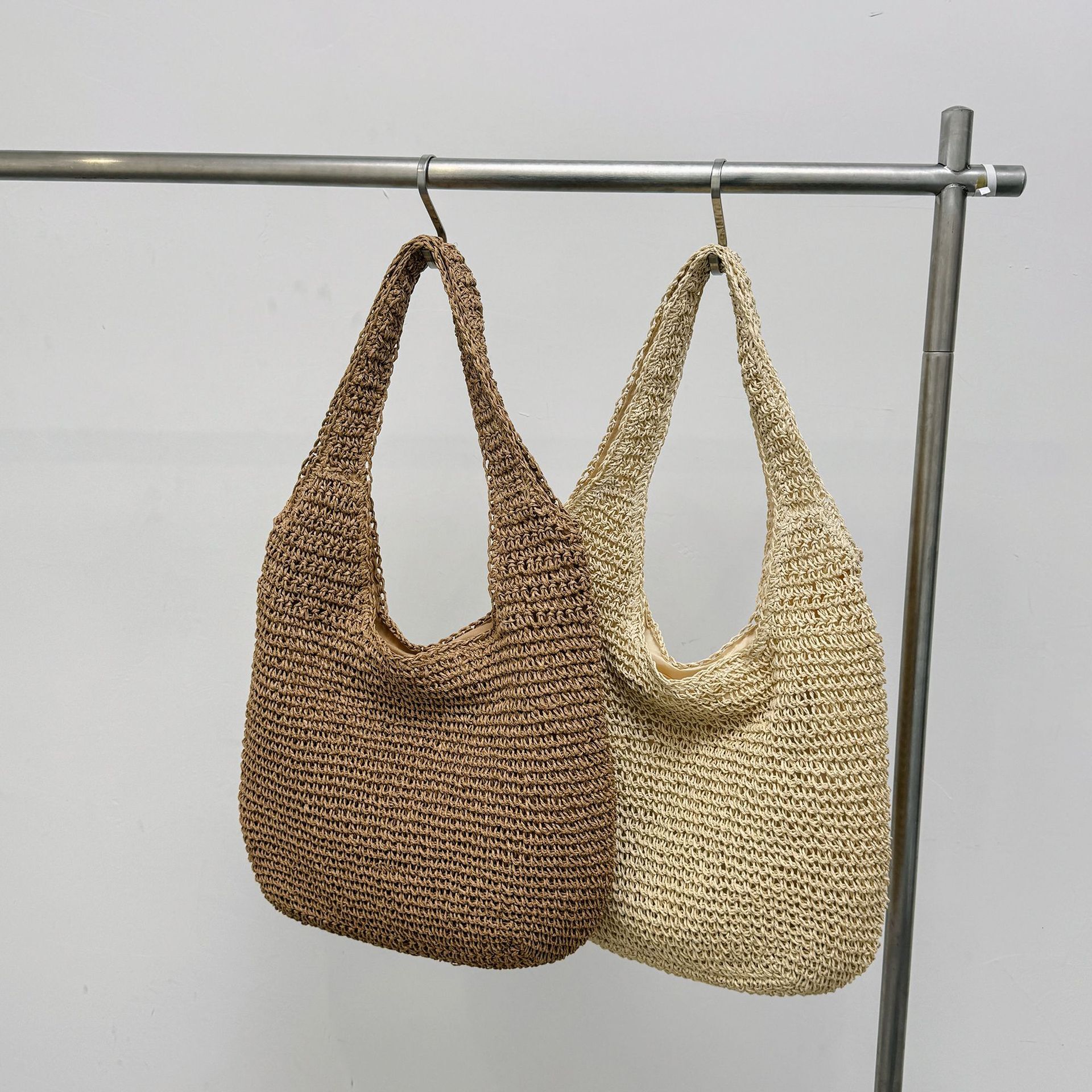 2025S Designer Women S Bag Spring And Summer Vacation Style Tote Grass Woven Shopping Women S Hand Held Beach Versatile Solid Color Shoulder Bag