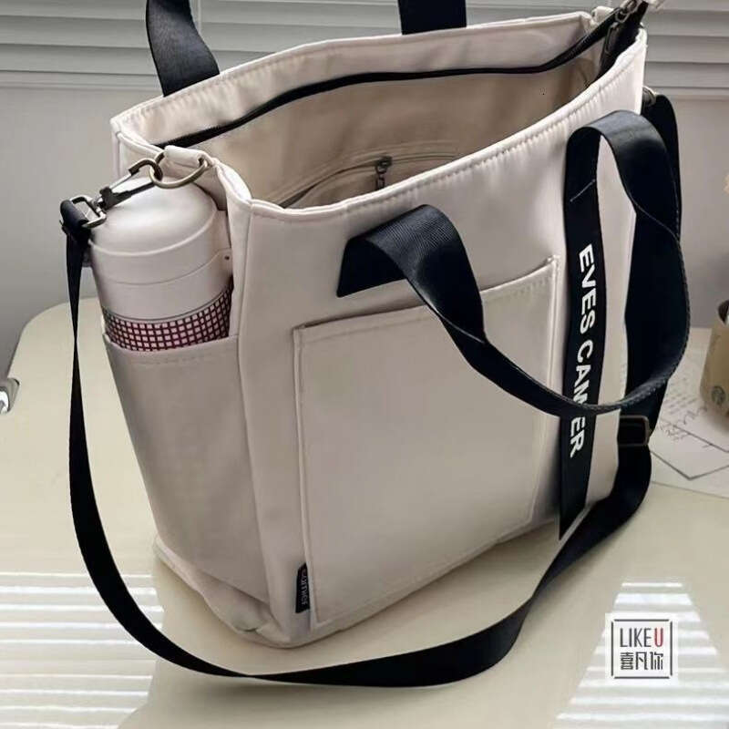 designer bag New design waterproof stylish tote canvas crossbody bag, simple and versatile, single shoulder hand-held bento lunch box bag