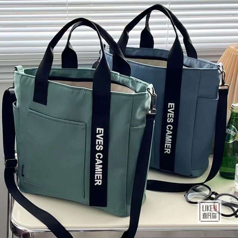 designer bag New design waterproof stylish tote canvas crossbody bag, simple and versatile, single shoulder hand-held bento lunch box bag