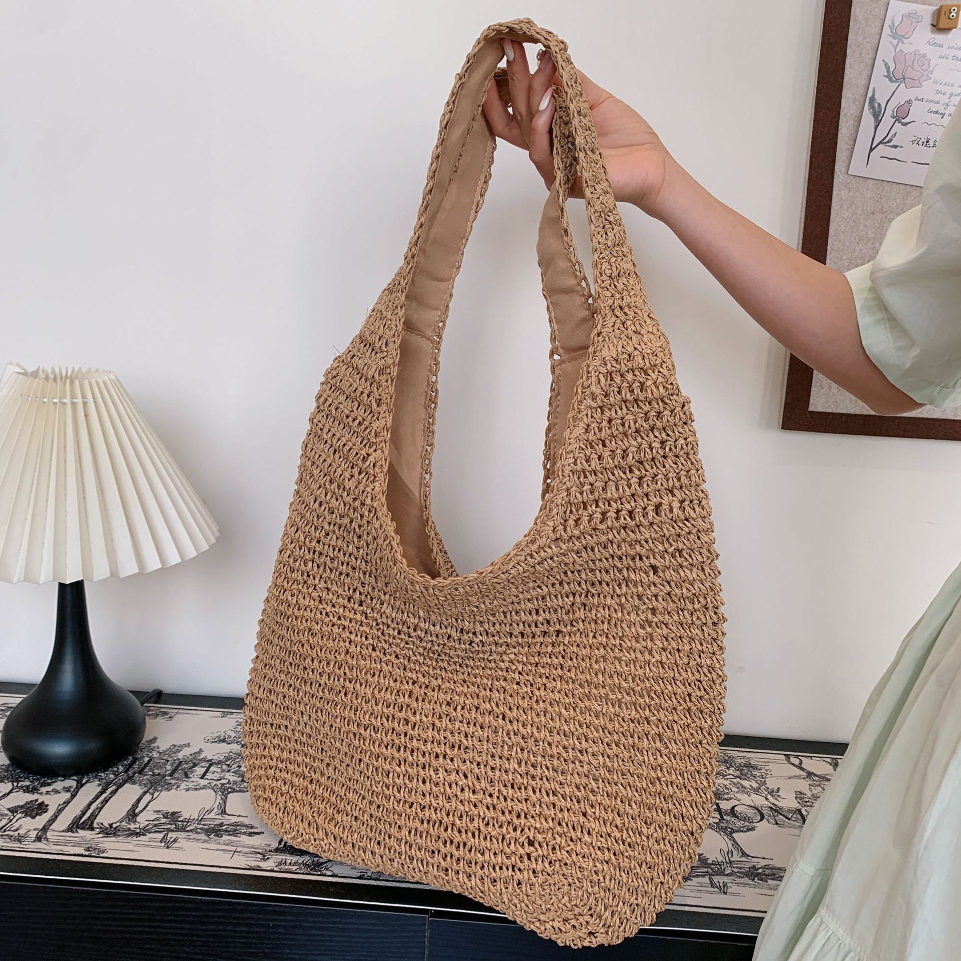 2025S Designer Women S Bag Spring And Summer Vacation Style Tote Grass Woven Shopping Women S Hand Held Beach Versatile Solid Color Shoulder Bag