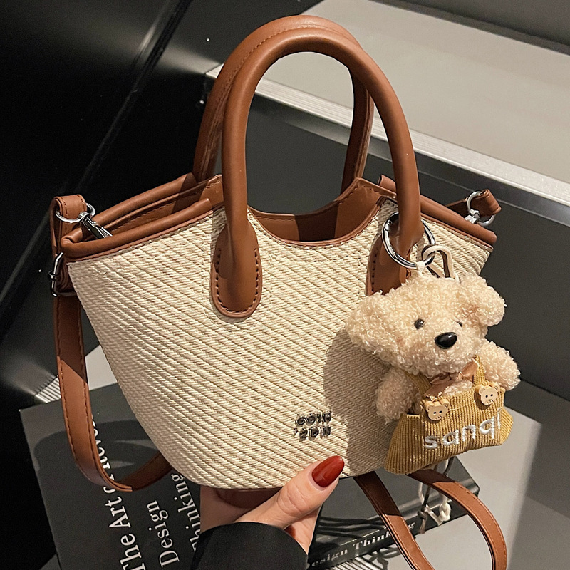 2025S Designer Niche Design Single Shoulder Women S Spring And Summer Color Contrasting Crossbody Urban Minimalist Handheld High hot End Water Bucket 