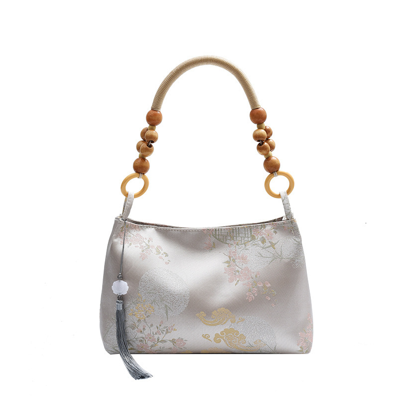 2025S Designer Women S Bag New For Women New Niche Velvet Embossed Artistic Chinese Style Armpit Bag Simple Wooden Bead Casual Handbag