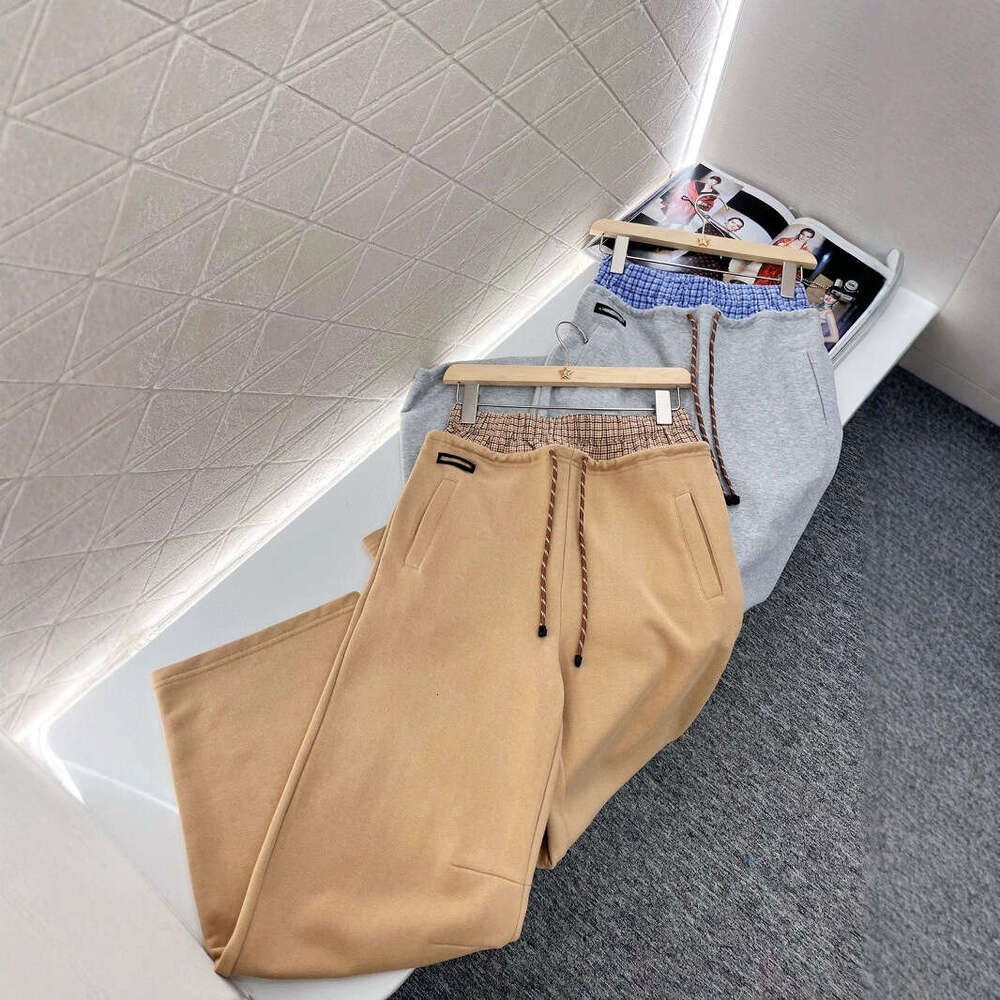 Designer clothing Designer clothing Nanyou Miu series casual for spring 2025, new color blocking plaid double waistband drawstring letter logo straigh