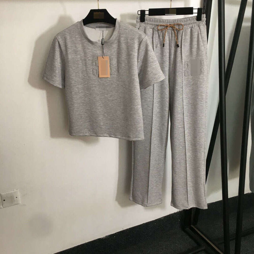 Designer clothing 25 New Nanyou Sports Set Fashion Embroidered Letter Patch Short Sleeve T-shirt+Elastic Waist Casual Straight Pants