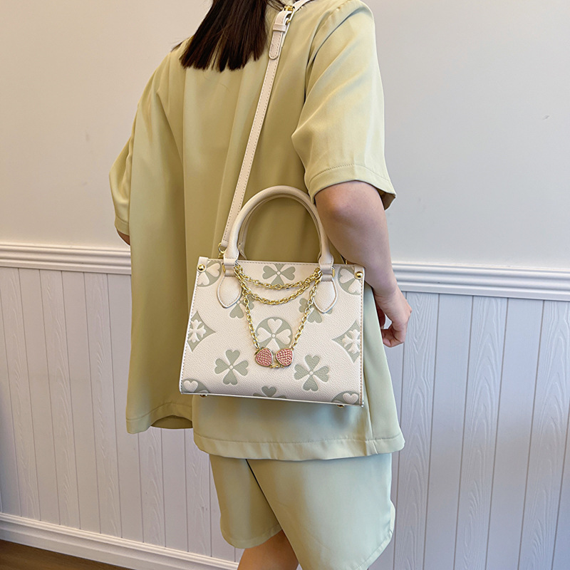 2025 Women's old flower handbag new style fashionable embossed shoulder small square bag high-end sense versatile for commuting cross body bag