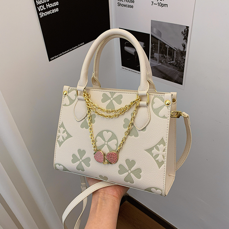 2025 Women's old flower handbag new style fashionable embossed shoulder small square bag high-end sense versatile for commuting cross body bag