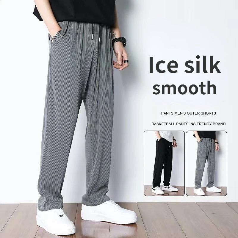 Ice silk pants for men in summer thin and loose with a light beam and drooping feet. Quick drying and casual mens Trouser trend. Nine oclock harem spo