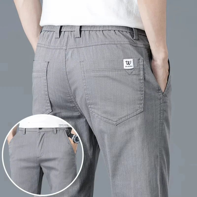 Mens slim fit straight casual pants for spring and summer solid color Korean elastic business cotton mens 250414Z