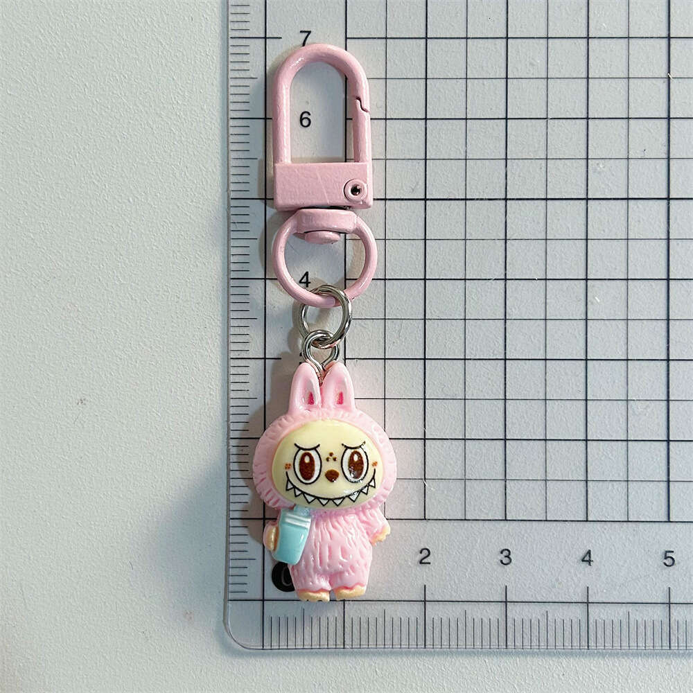 Cute Labubu Keychain on Drinking Milk Tea Cup - Colorful Cartoon Doll Pendant for Student Backpacks