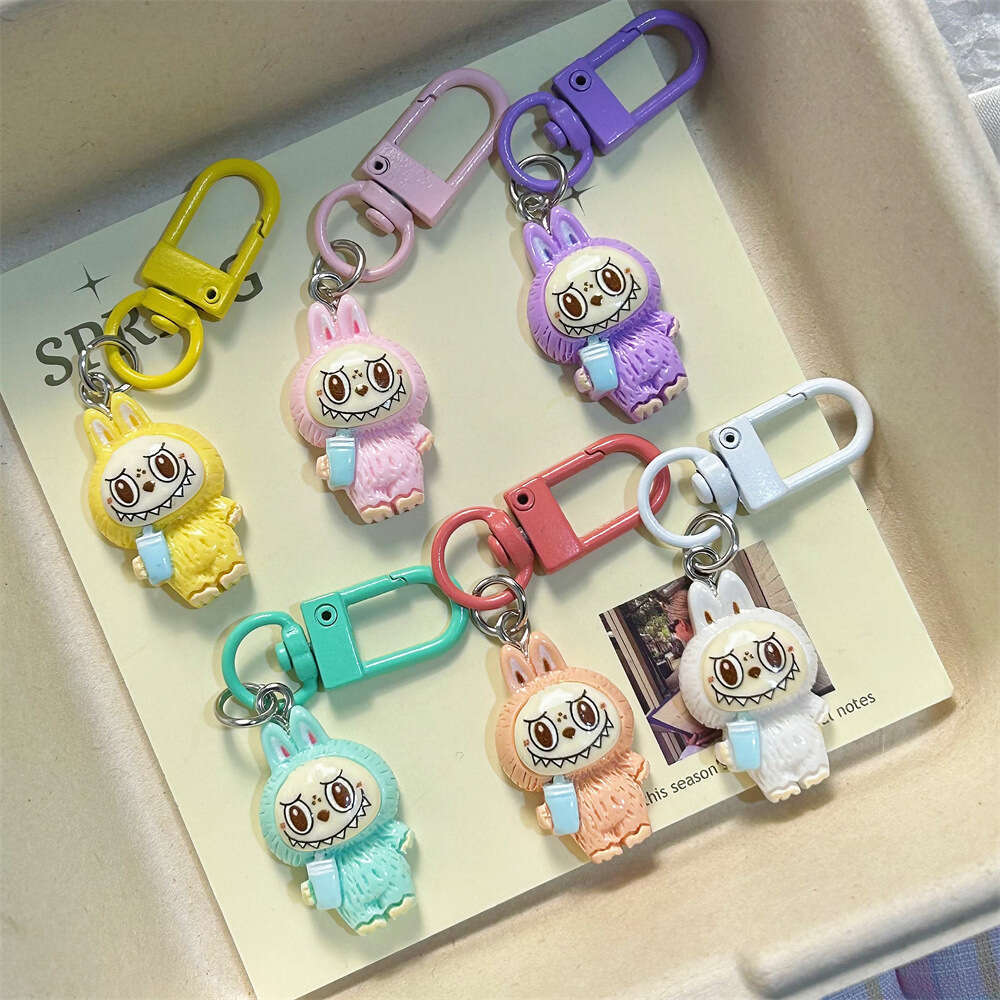 Cute Labubu Keychain on Drinking Milk Tea Cup - Colorful Cartoon Doll Pendant for Student Backpacks