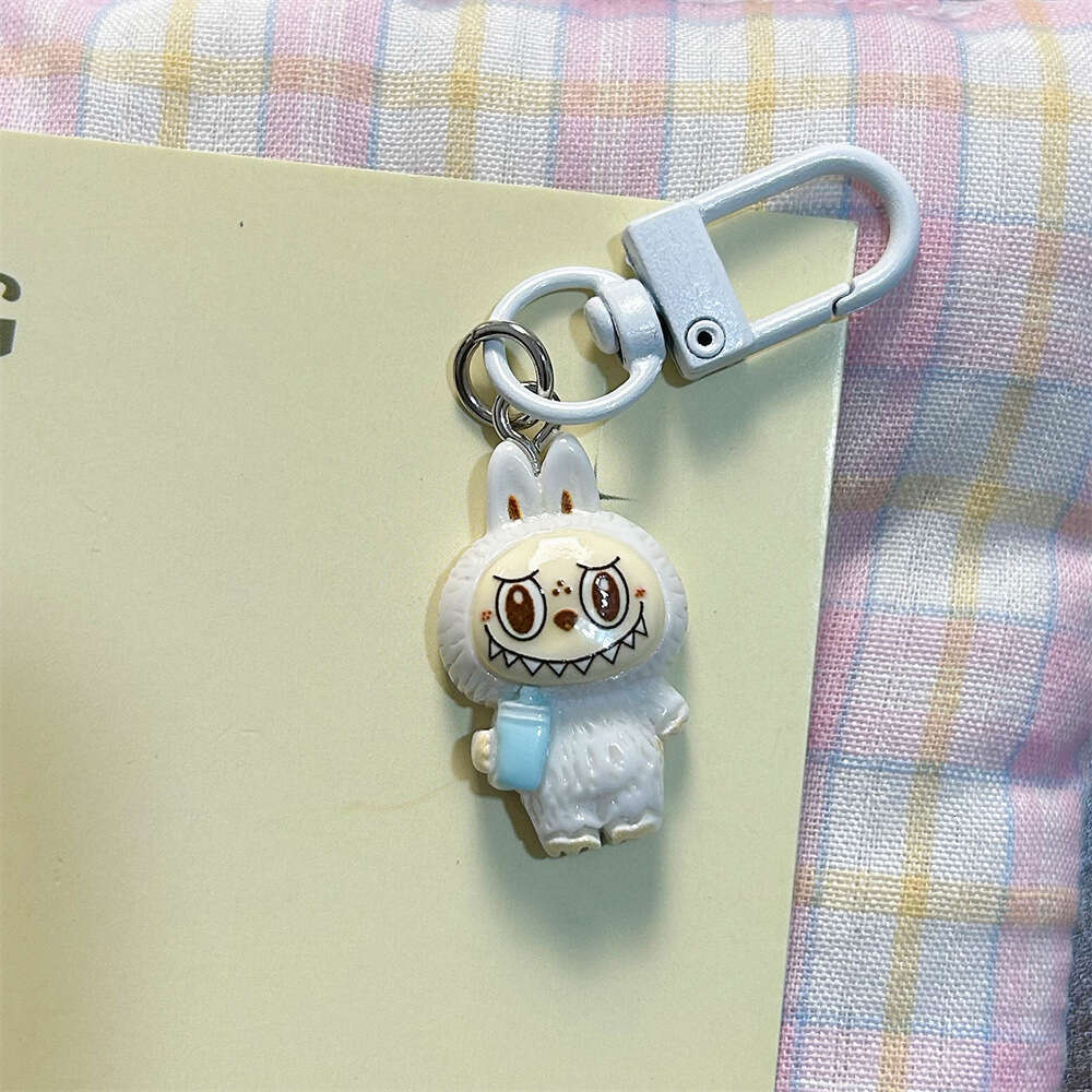Cute Labubu Keychain on Drinking Milk Tea Cup - Colorful Cartoon Doll Pendant for Student Backpacks