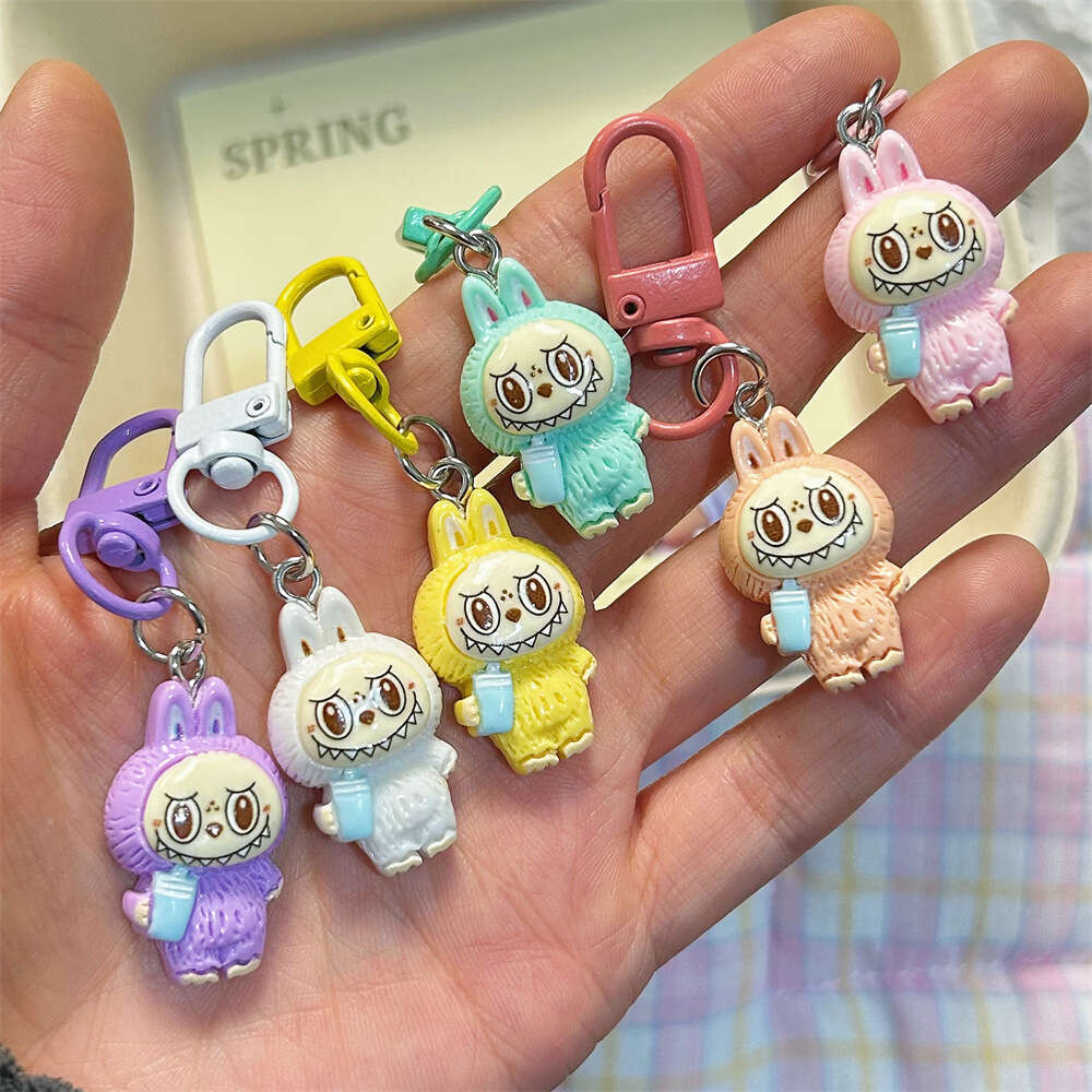 Cute Labubu Keychain on Drinking Milk Tea Cup - Colorful Cartoon Doll Pendant for Student Backpacks