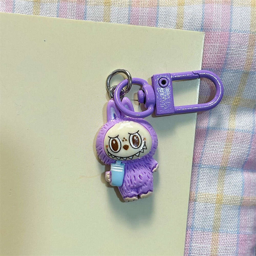 Cute Labubu Keychain on Drinking Milk Tea Cup - Colorful Cartoon Doll Pendant for Student Backpacks