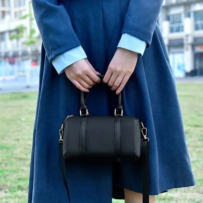 Womens bag simple and fashionable Versatile single shoulder cylindrical bag fresh sweet hand pillow bag cross body bag 250410