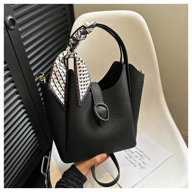Designer 2025S soft leather niche handbag fashionable women versatile large capacity shoulder crossbody bucket bag