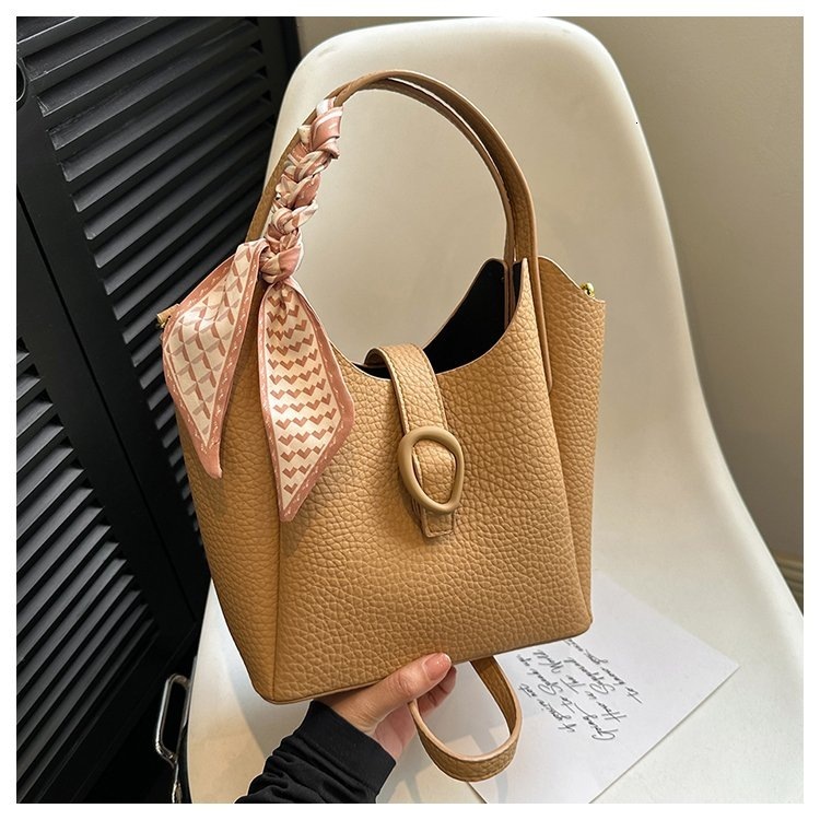 Designer 2025S soft leather niche handbag fashionable women versatile large capacity shoulder crossbody bucket bag