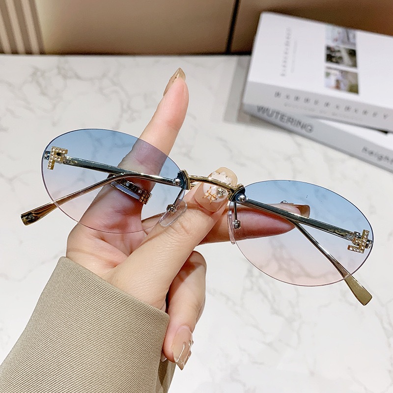Free shipping designer frameless European American fashion street style trendy retro elegant letter oval sunglasses