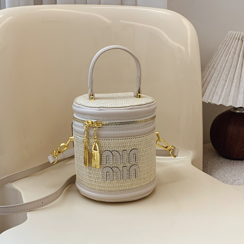 designer bag 2025 new Women's small rattan bag, fashionable and trendy niche crossbody bag textured contrasting color letter hand-held bucket bag